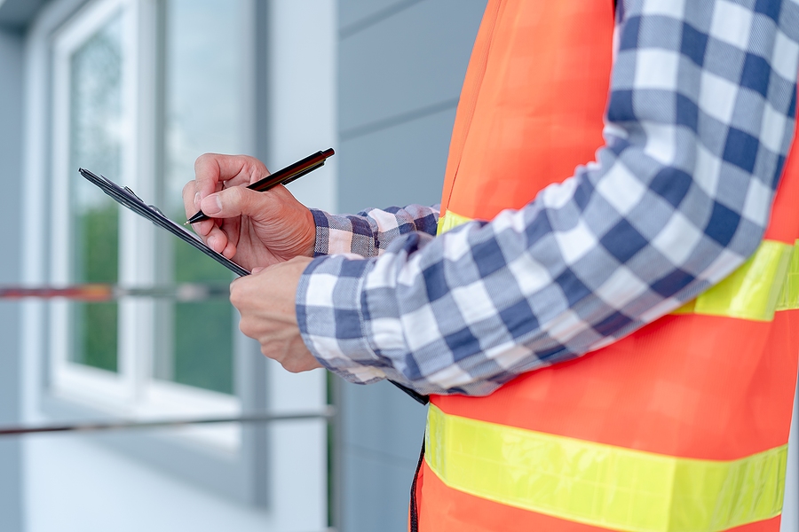 Home performance expert performing a home evaluation.