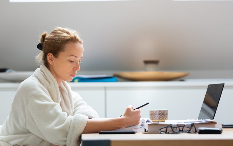 Young Female Entrepreneur Wearing Cosy Warm Bathrobe Working Rem